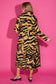 Alden Adair Darby long tiger-print coat with black and gold pattern, shown from the back.