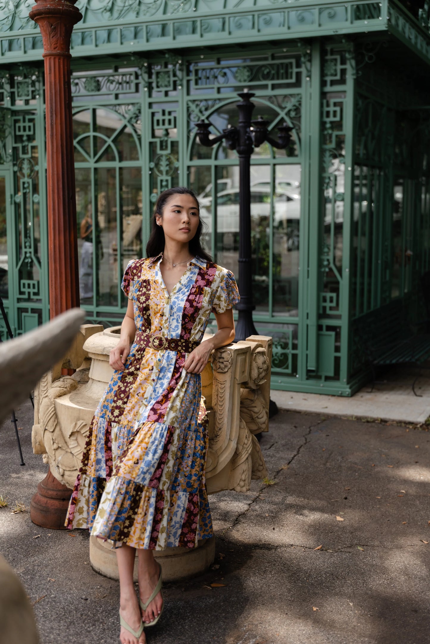 Alden Adair Luna Dress Golden Bouquet patchwork floral midi dress with brown belt and puff sleeves, front view on model outdoors.