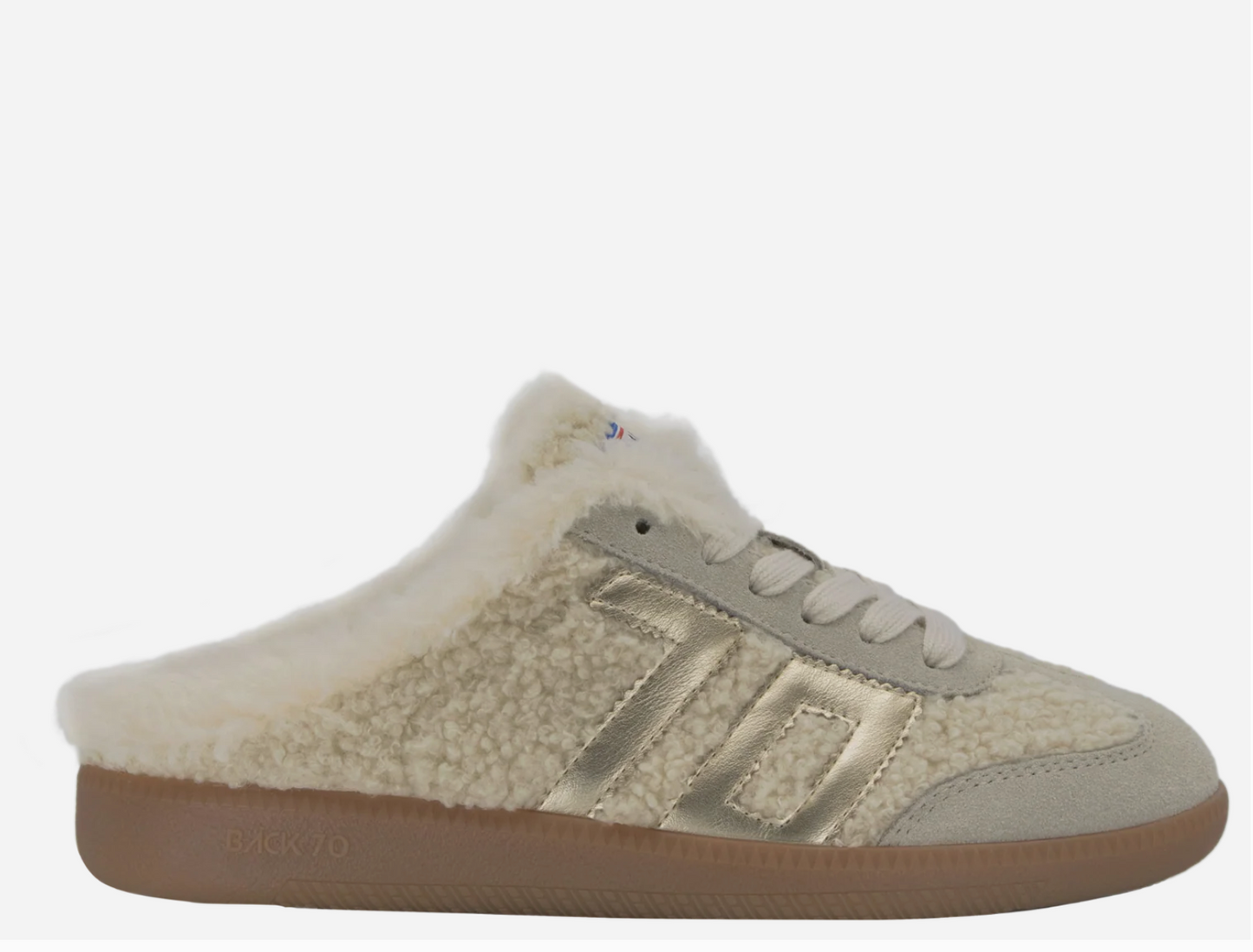 Back 70 Easter FL backless sneaker mule featuring shearling upper, gold metallic stripe detail, and gum sole.