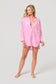 Vacay Out Of Office pink oversized button-up cover-up shirt with embroidered chest pocket, worn open over white bralette.