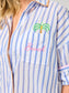 Shiraleah Beach Ocean Air Cover-Up Shirt close-up: blue-white stripes, chest pocket with embroidered palm tree and 'Beach' in pink.