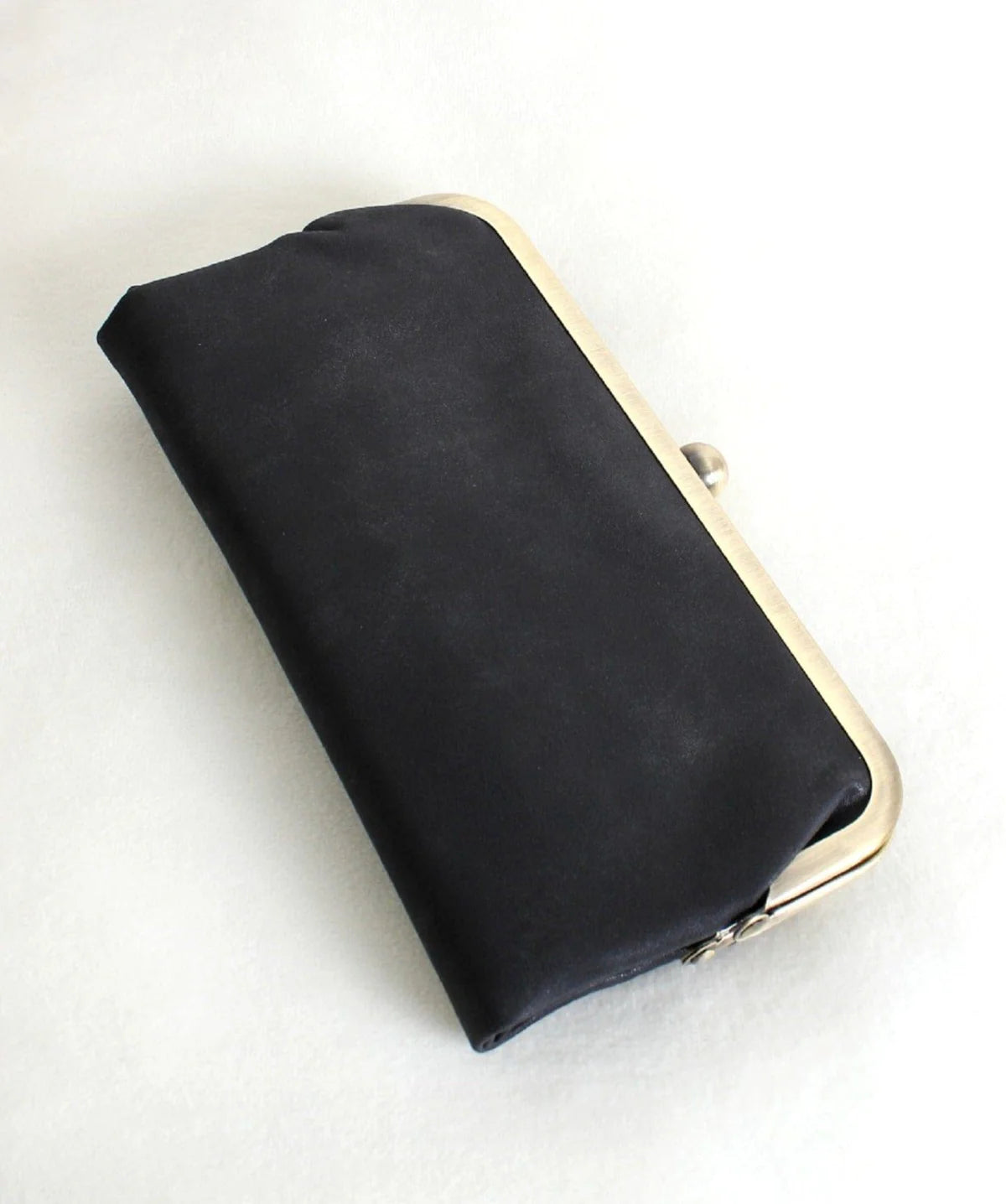Karen Kiss Lock Clutch in black satin fabric with gold-toned metal kiss lock frame closure.