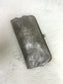 Karen Kiss Lock Clutch in metallic pewter leather with antique silver kiss lock frame closure, displayed on white fur back...