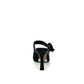 EXE Lamina-290 black honeycomb mesh woven stiletto mule heels with decorative bow detail, rear view.