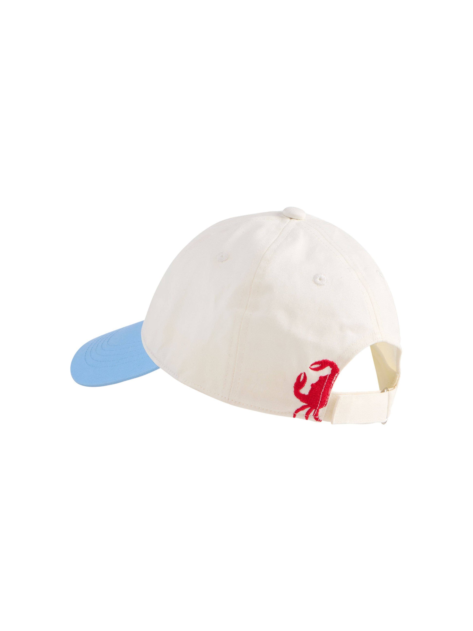 Crab Ball Cap with cream crown, light blue brim, and red embroidered crab logo on side.