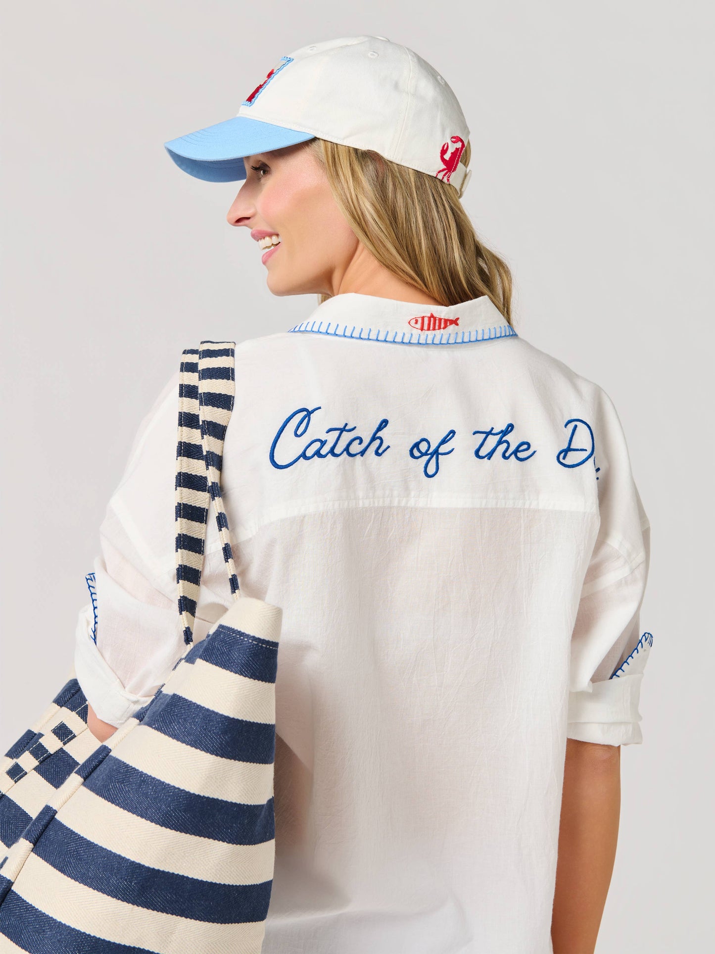 Crab Ball Cap with white crown, light blue brim, and red embroidered crab detail.