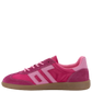 Back 70 Ghost C26 sneaker in fuchsia pink with three-stripe detail, suede overlays, pink laces, and gum rubber sole, side view.