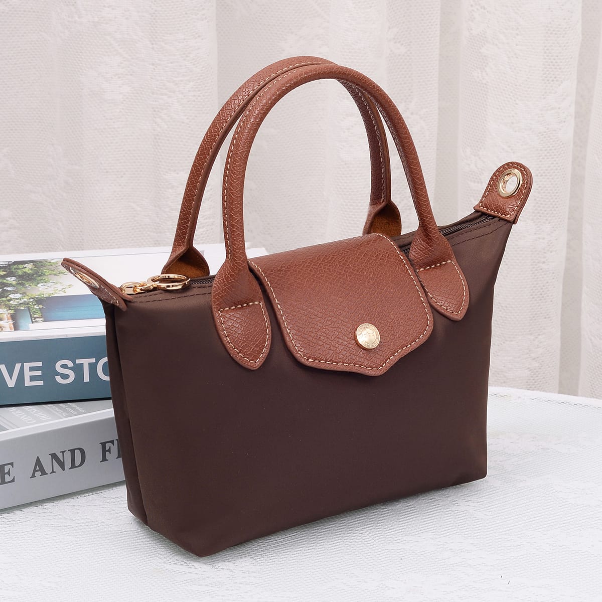 Britney Nylon Double Handle Crossbody Bag in Coffee with tan leather trim and gold hardware accents.