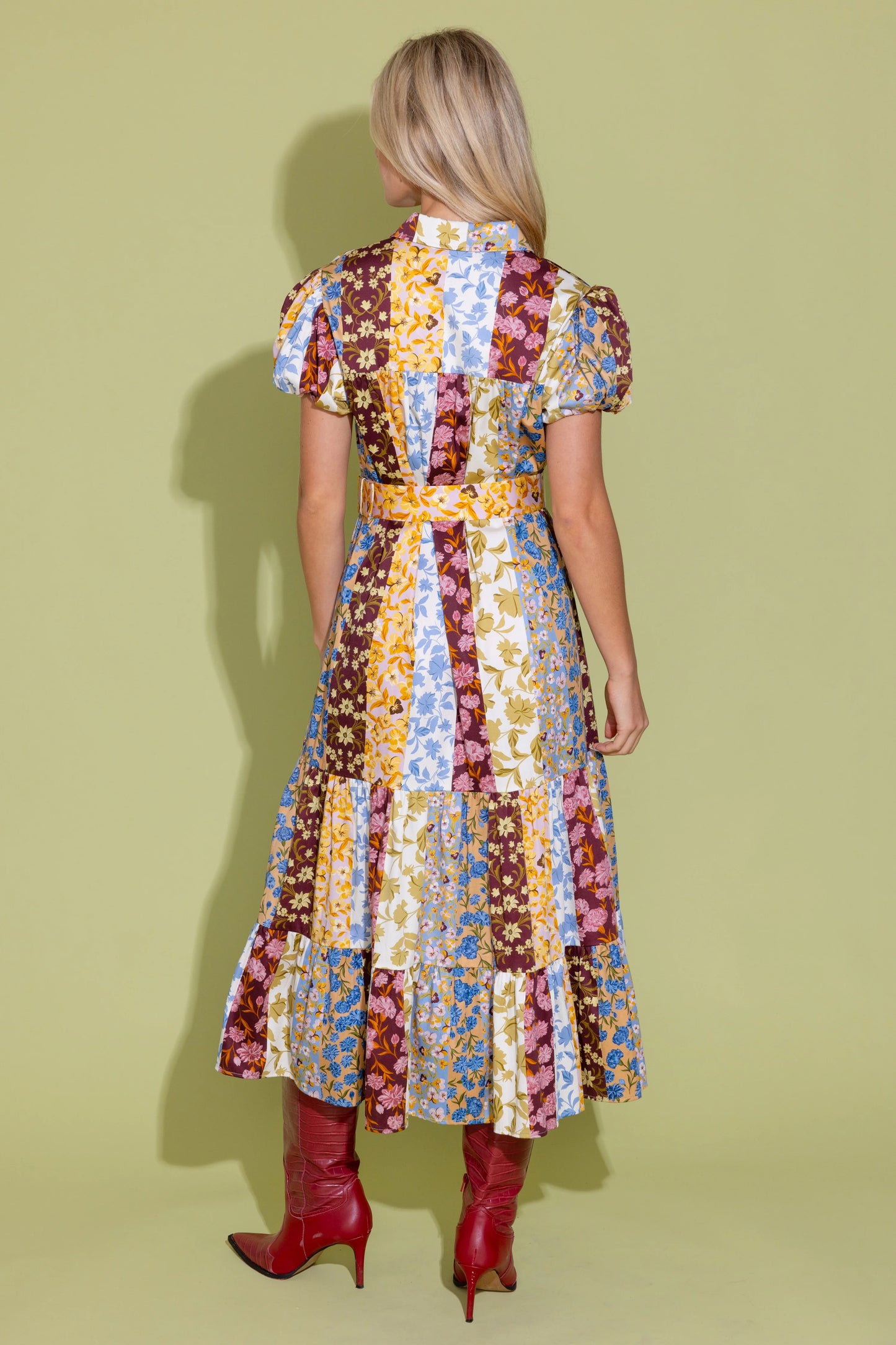 Alden Adair Luna Dress Golden Bouquet, back view, patchwork floral midi dress with puff sleeves, worn with red boots.