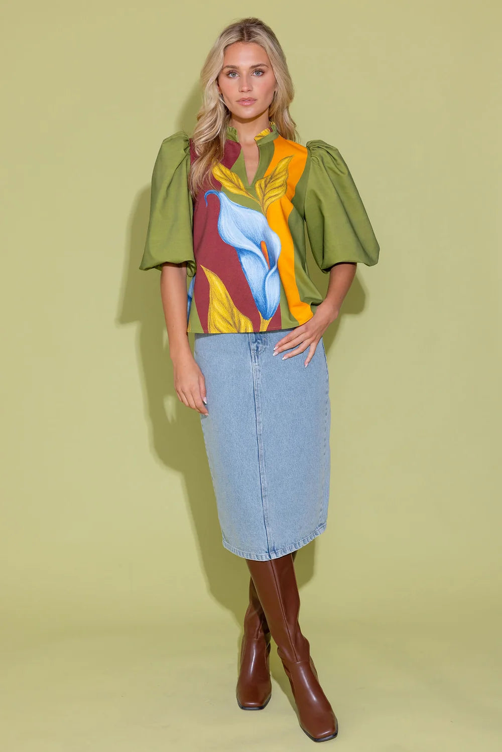Alden Adair Ali Top Calla Lily blouse with bold floral print, puffed sleeves, and ruffled neckline.