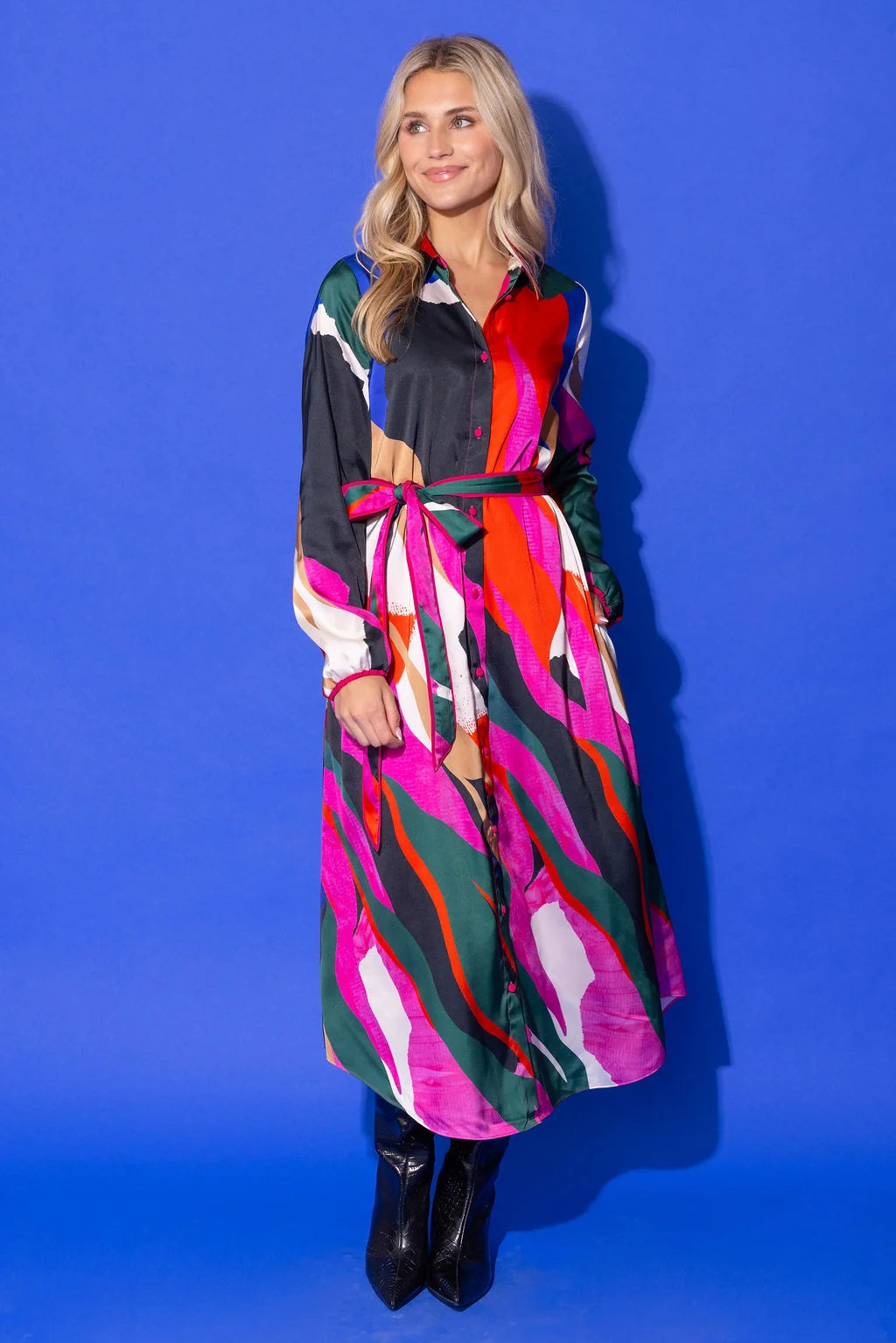 Alden Adair Bronte Dress Solar Vines: model wearing bold multicolor abstract print maxi shirtdress with tie waist, front view.
