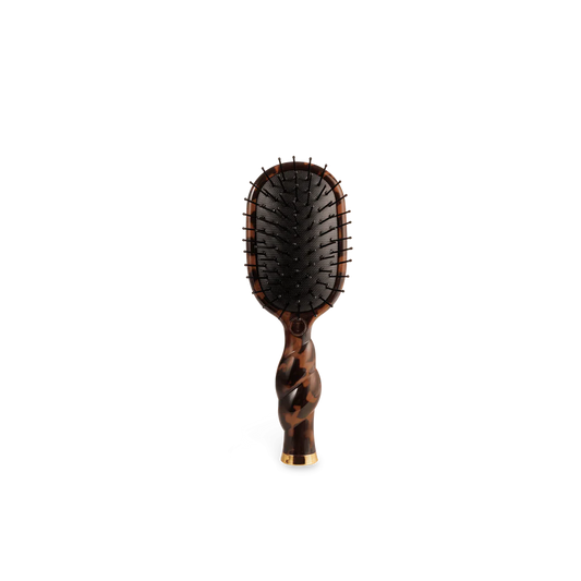 Teleties Mini Detangler Hair Brush in tortoise print with twisted handle, paddle head, and black bristles.